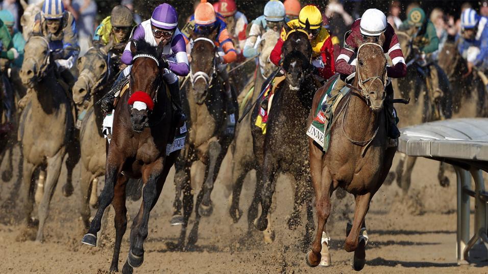 Horses racing on dirt